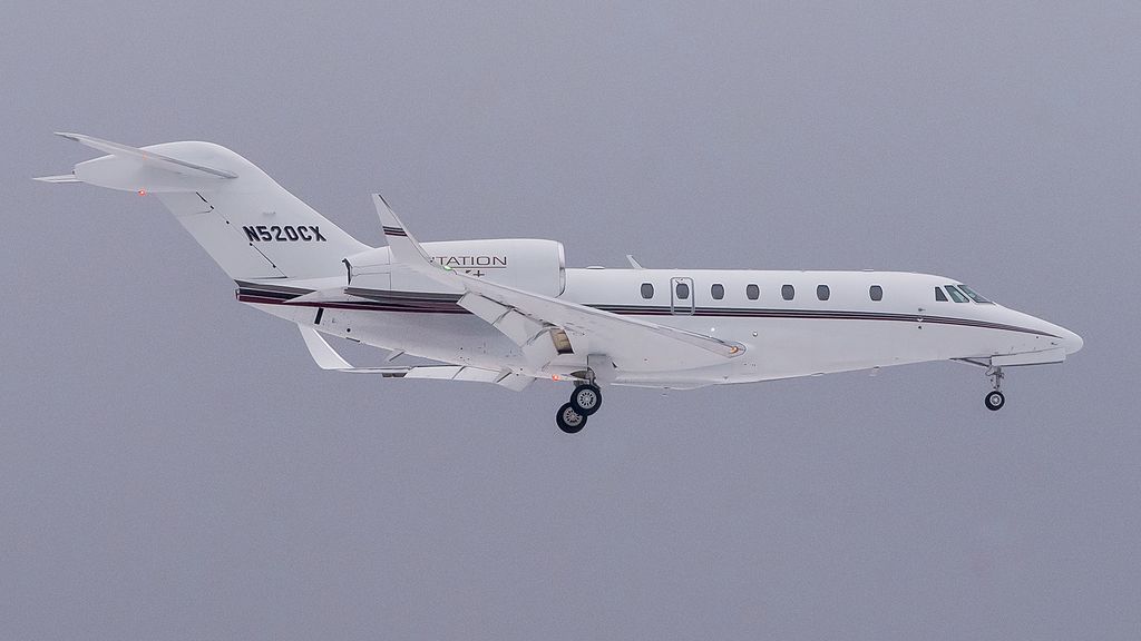 A white Cessna Citation X+ aircraft during flight.